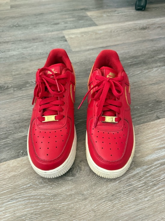 Nike Shoes - Nike Red Leather Low-Top Sneakers with Gold Accents